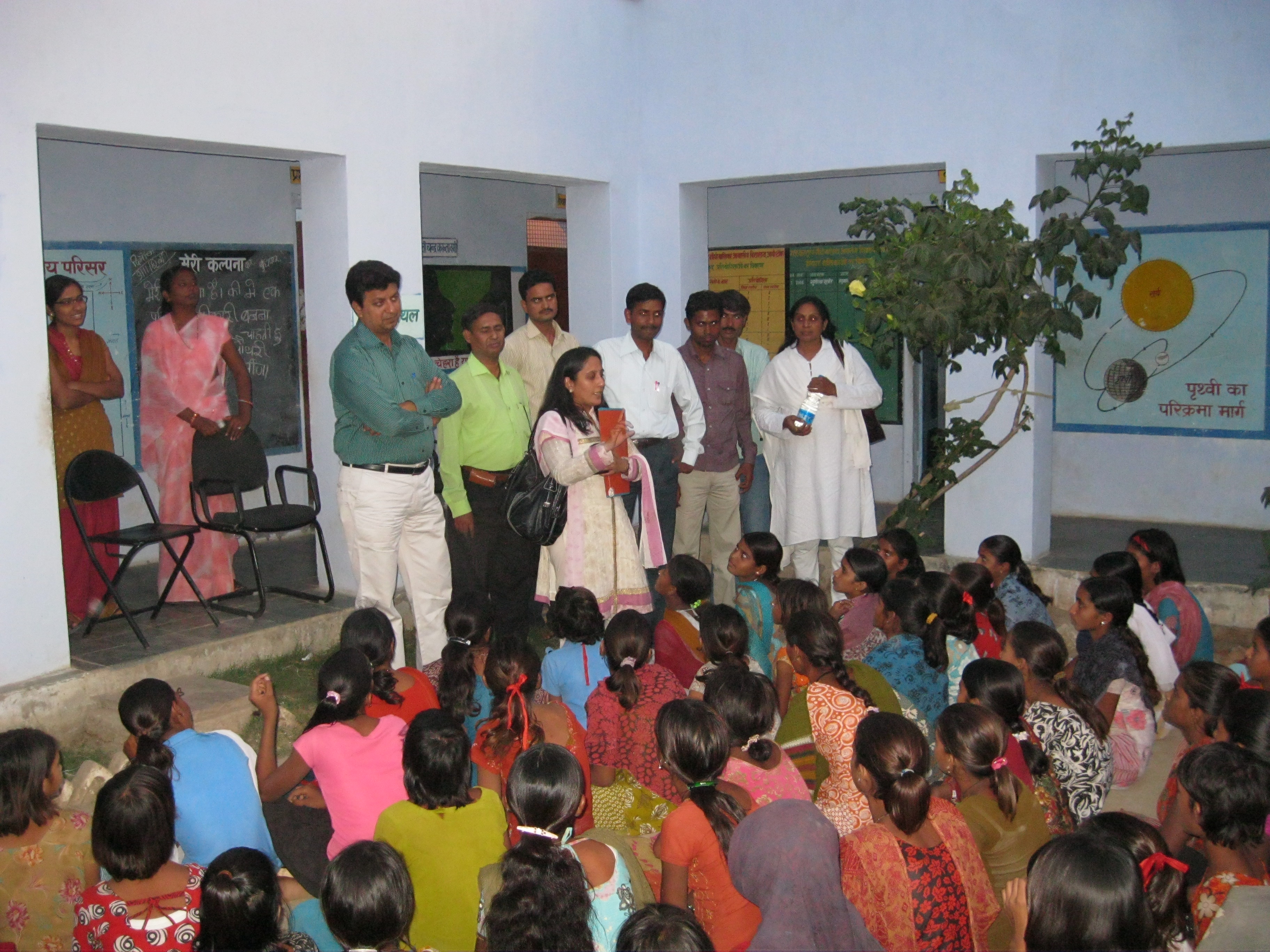 Shobha addressing a group of girls at a rural school in India